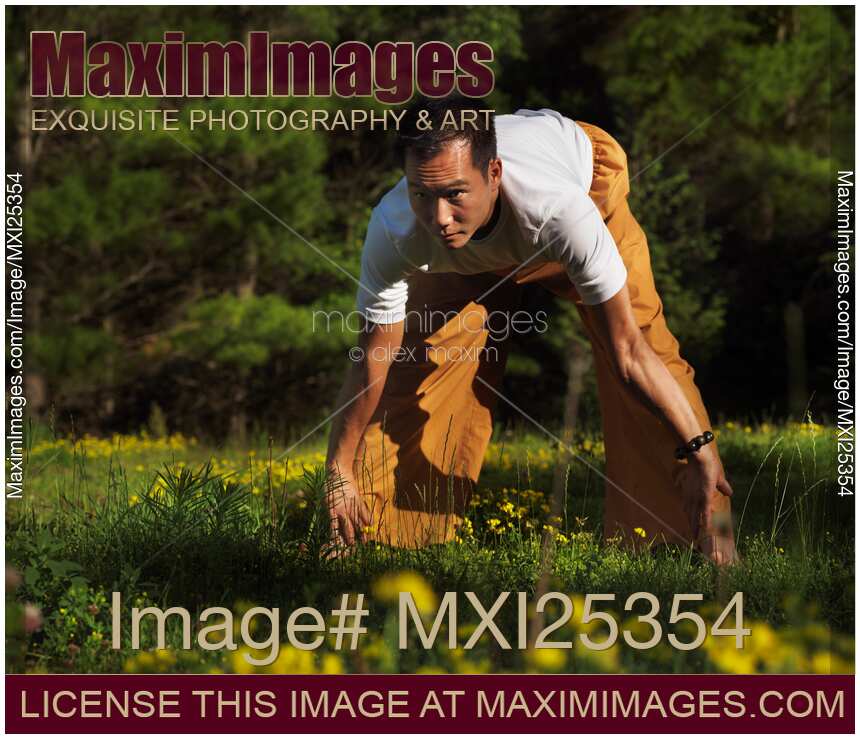 Man practicing Qi Gong outdoors