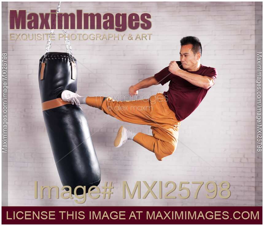 Martial artist practicing flying kick