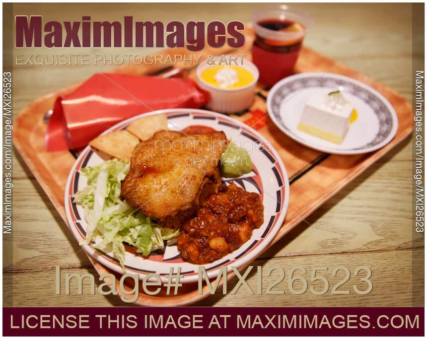 Mexican dish chicken and beans at restaurant