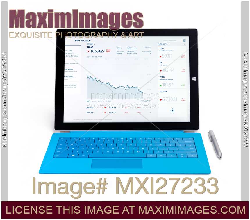 Microsoft Surface Pro 3 tablet with stock market charts on dispaly