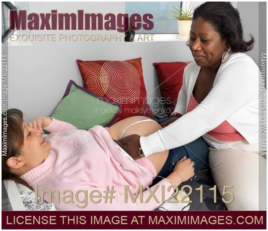 Midwife Measuring Pregnant Woman's Fundal Height