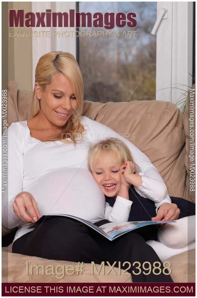 Mother and daughter reading a book together