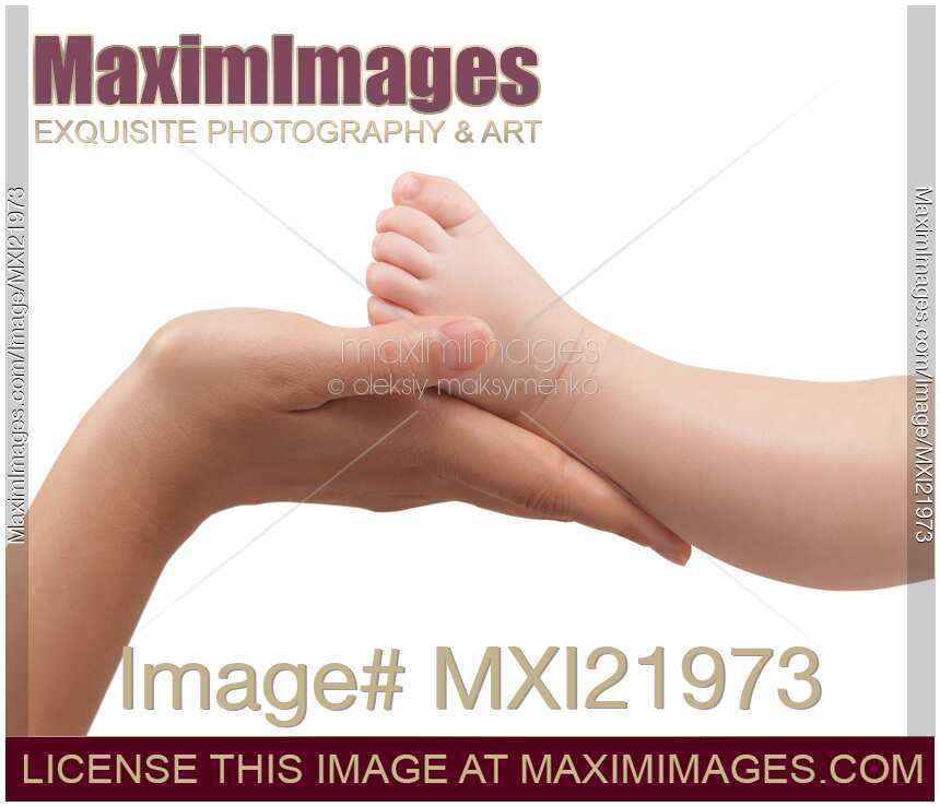Mother Holding Baby's Foot in Her Hands