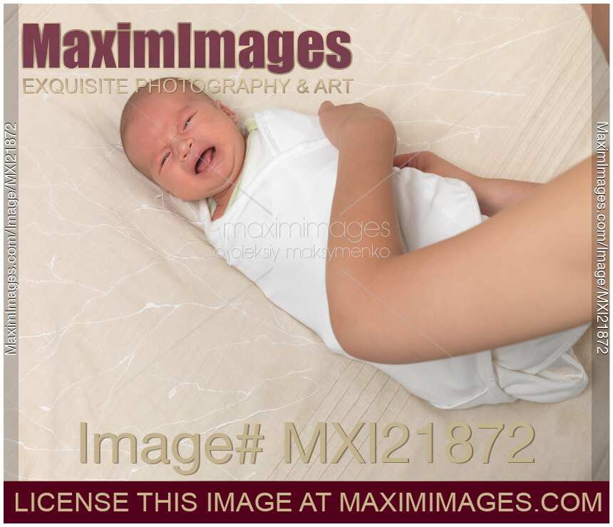 Mother Swaddling a Baby