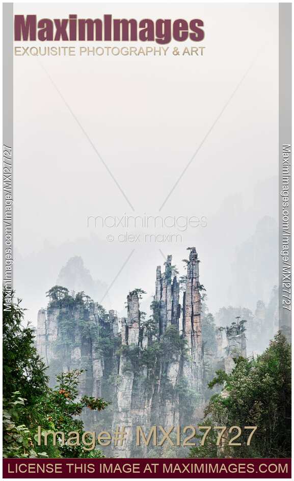 Mountain peaks in fog Zhangjiajie National Forest Park