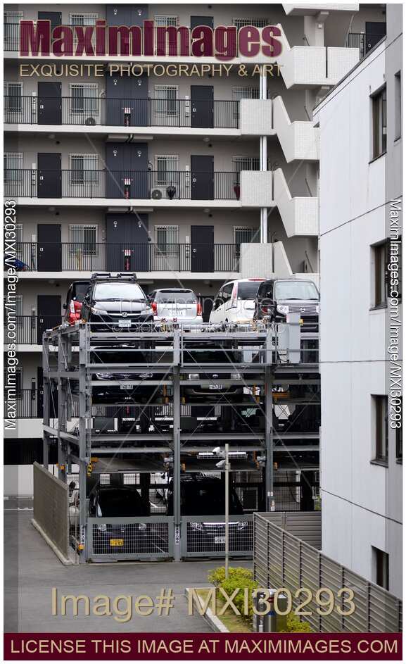 Photo of Multilevel vertical threestorey automated parking lot with a lift in Japan Stock