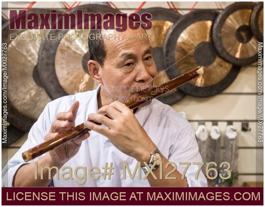 Music store owner plays flute