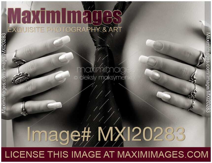 Naked woman wearing tie covering her breasts