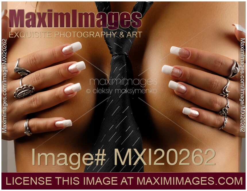 Naked woman with necktie covering her breasts