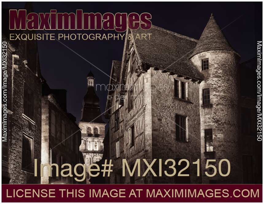 Narrow old street in medieval town lit by a street lamp at night France Fine art black and white