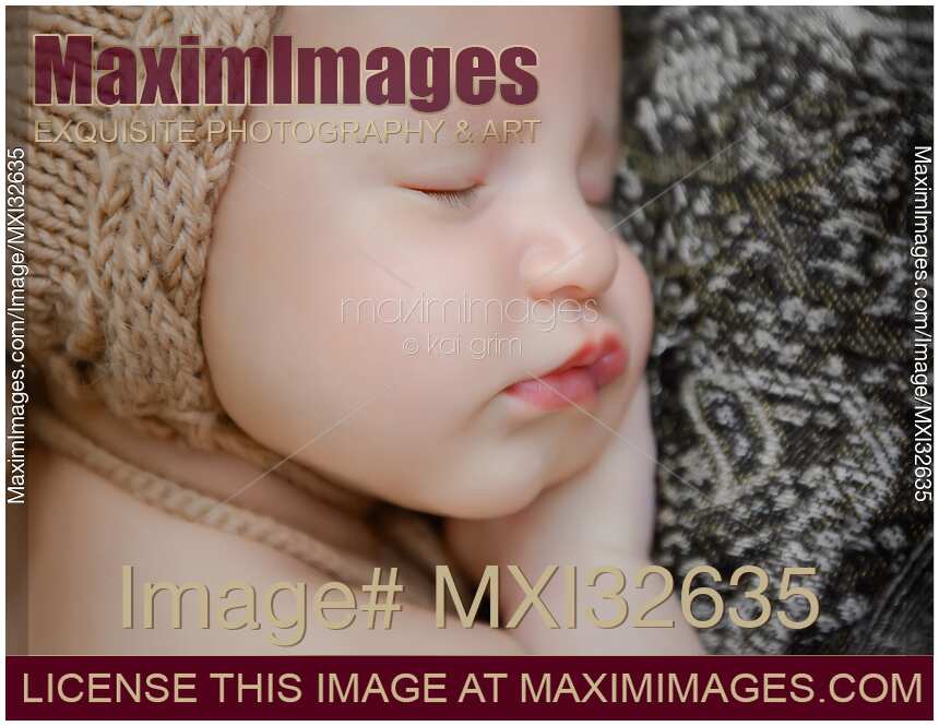 Newborn baby girl sleeping closeup of a cute face
