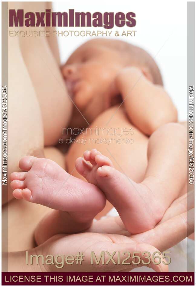 Newborn baby sleeping in mother arms