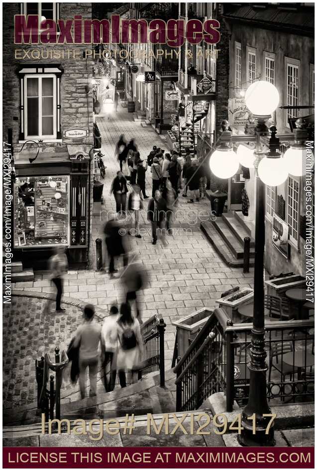 Nightlife on historic streets of Old Quebec City Rue Sous-Le-Fort and Rue du Petit-Champlain Black and white