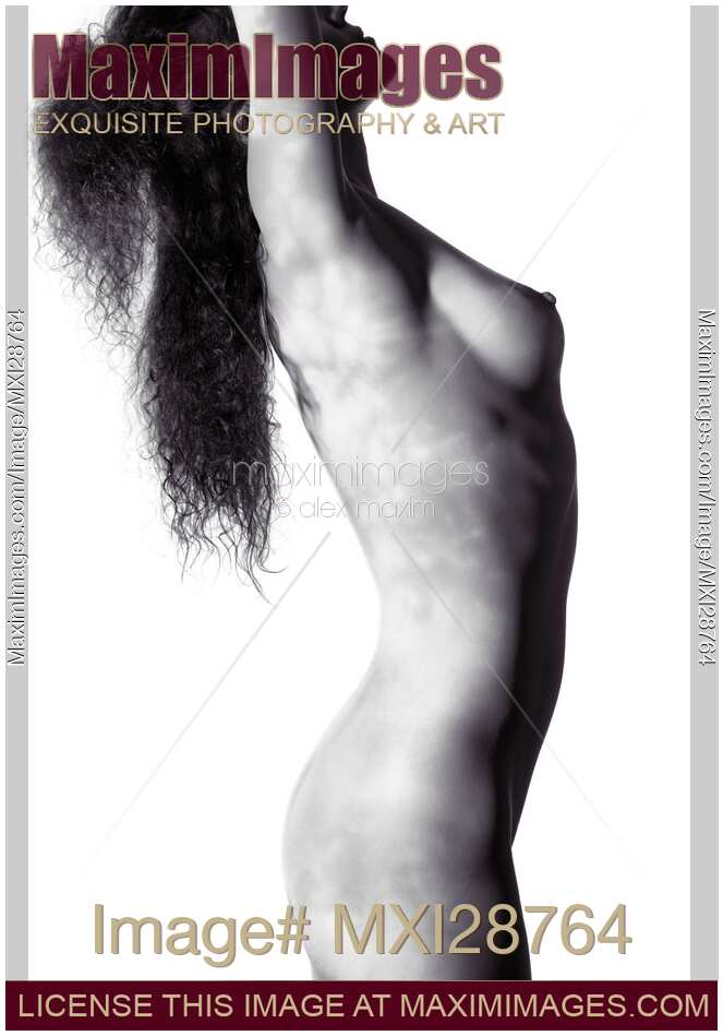 Nude woman body with light pattern of leaves on her skin