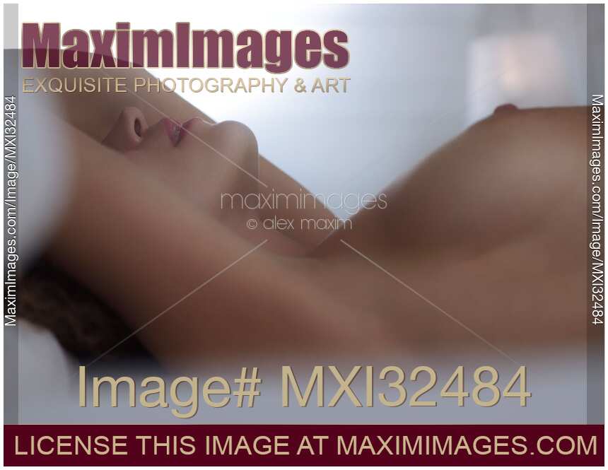 Nude woman lips and bare breast couple making love in bed implied sexual foreplay