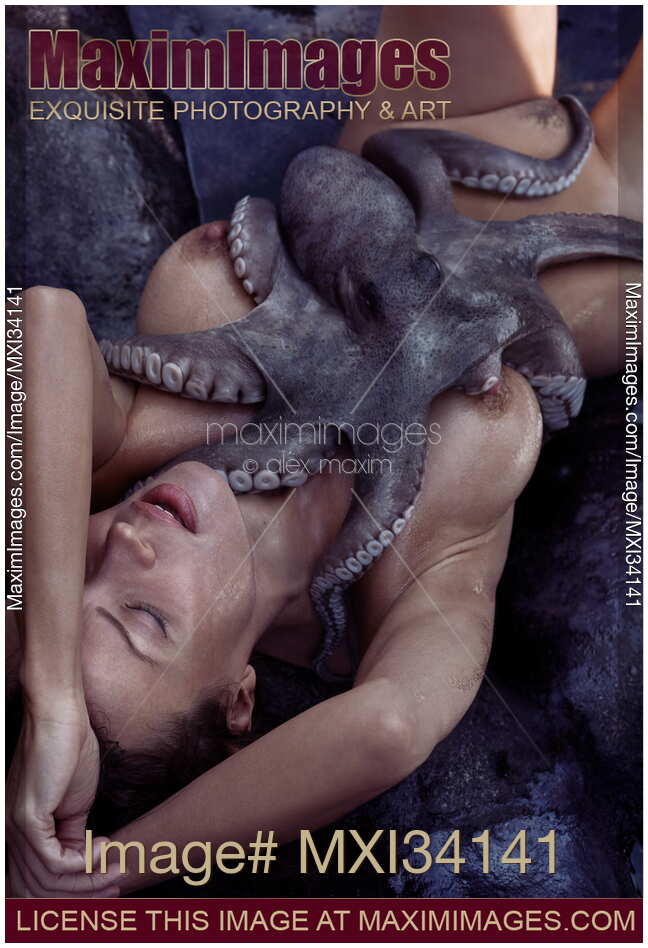 Nude woman lying on sea shore in passionate embrace of octopus tentacles caressing her naked sensual body