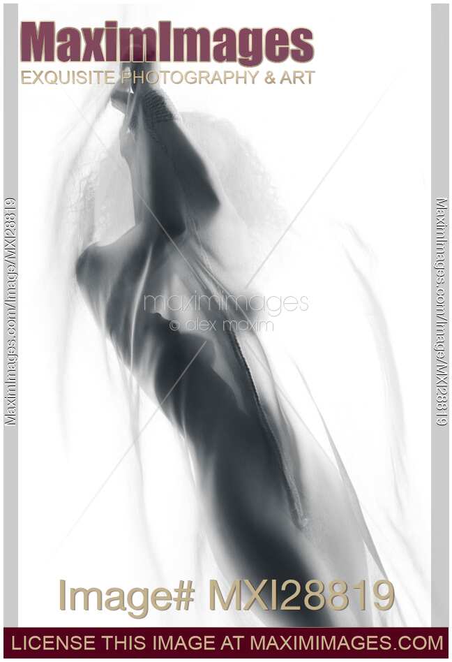 Nude woman stanging behind sheer cloth with her hands tied
