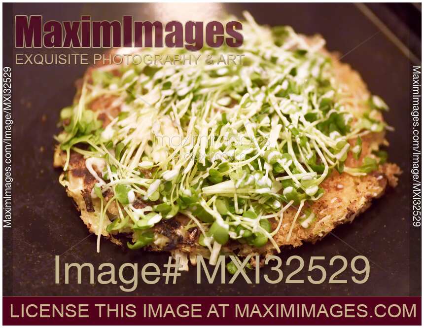 Okonomiyaki with radish sprouts traditional Japanese cuisine in Kyoto restaurant