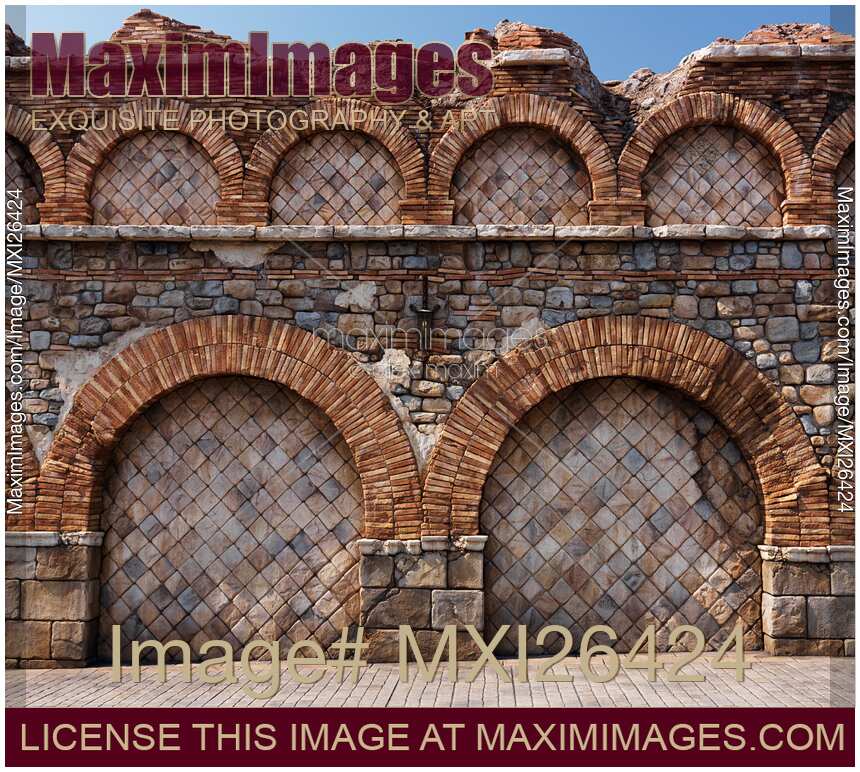 Old stone wall with brick arches texture