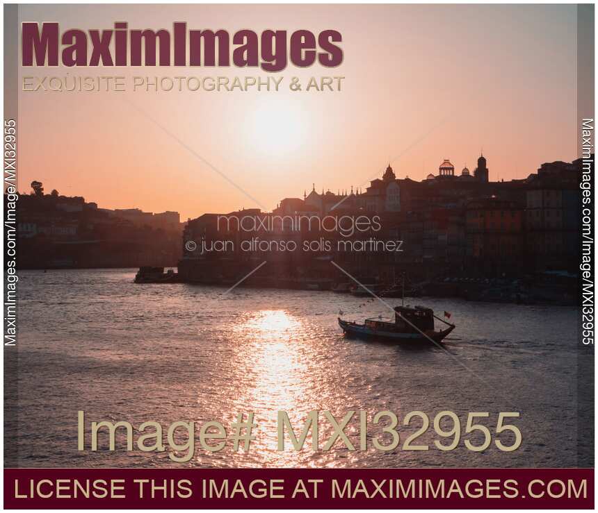 Old town Ribeira city skyline in Porto Portugal during sunset Douro river