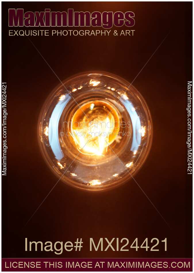 One lit incandescent light bulb