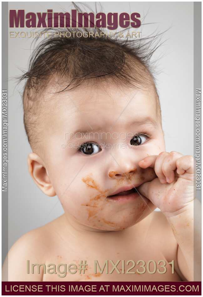One Messy Baby Boy Sucking His Thumb