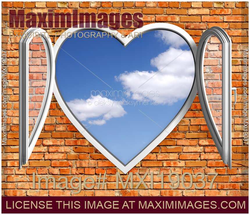 Open heart-shaped window in brick wall