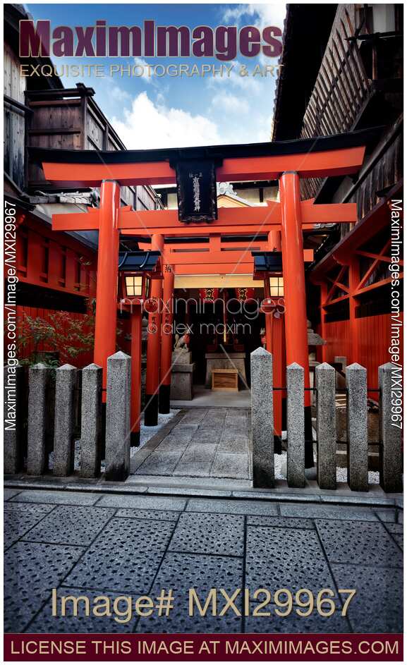Orange Torii of little Inari Shinto shrine in Kyoto