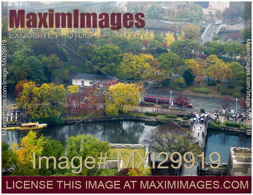 Osaka Castle Park canal with boats Gokurakubashi bridge over the moat and sightseeing train aerial autumn scenery