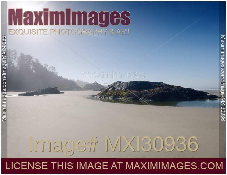 Pacific Rim National Park surreal morning scenery of the sandy beach during low tide in Tofino BC