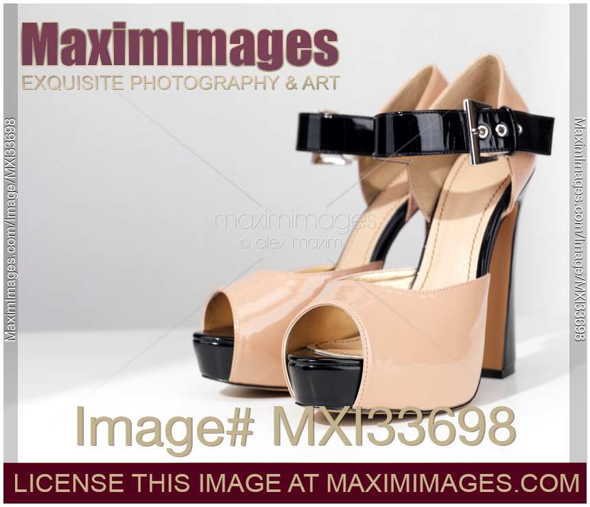 Pair of sexy beige open-toe high heel platform shoes