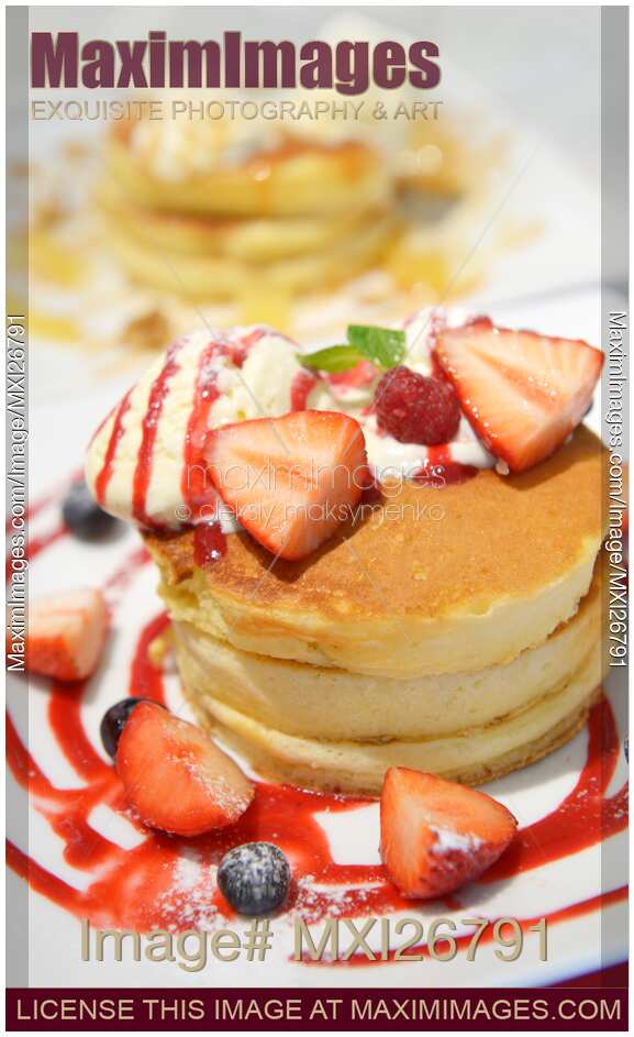 Pancakes with icecream and strawberries