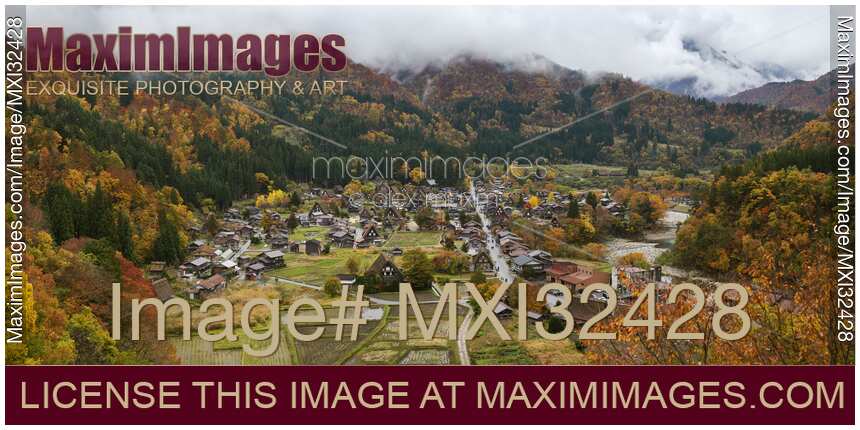 Panorama of Shirakawa-go traditional Japanese village autumn aerial scenery Gassho-zukuri rural houses and cultivated fields Japan
