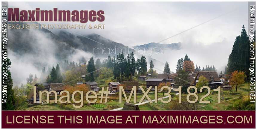 Panoramic foggy morning scenery of Ainokura Japanese mountain farm village with Gassho style houses in autumn