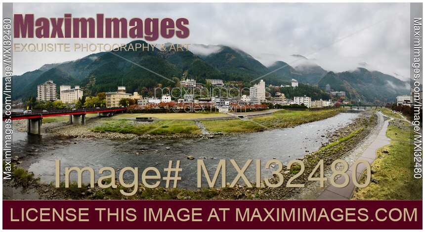 Panoramic scenery of hot springs resort town Gero Japan with foggy mountains