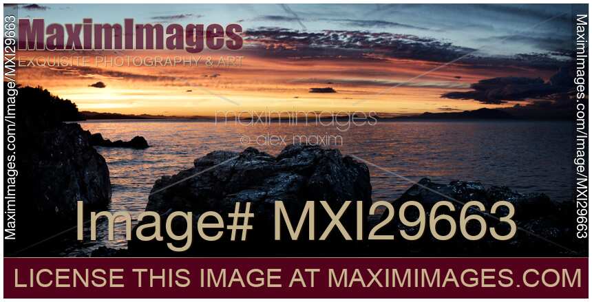 Panoramic sunset sky scenery of rocks on the ocean shore in Nanaimo Vancouver Island