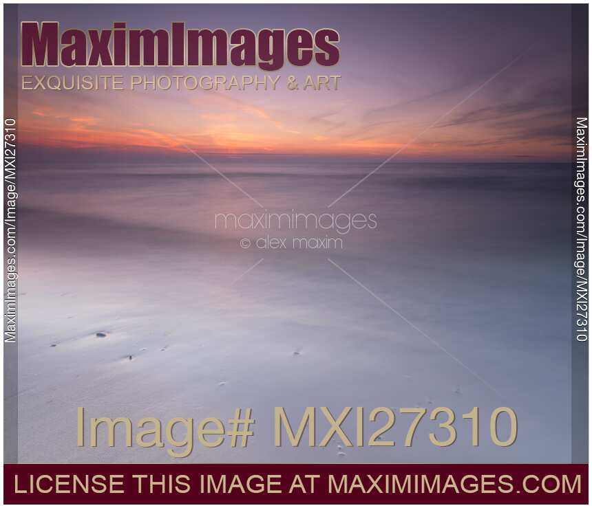 Peaceful sunset scenery with smooth calm water at lake Huron
