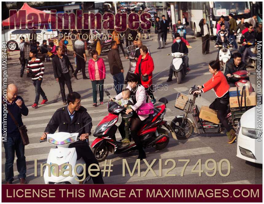 People and traffic at intersection in China