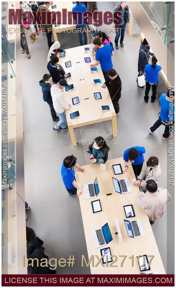 People at Apple store trying new products