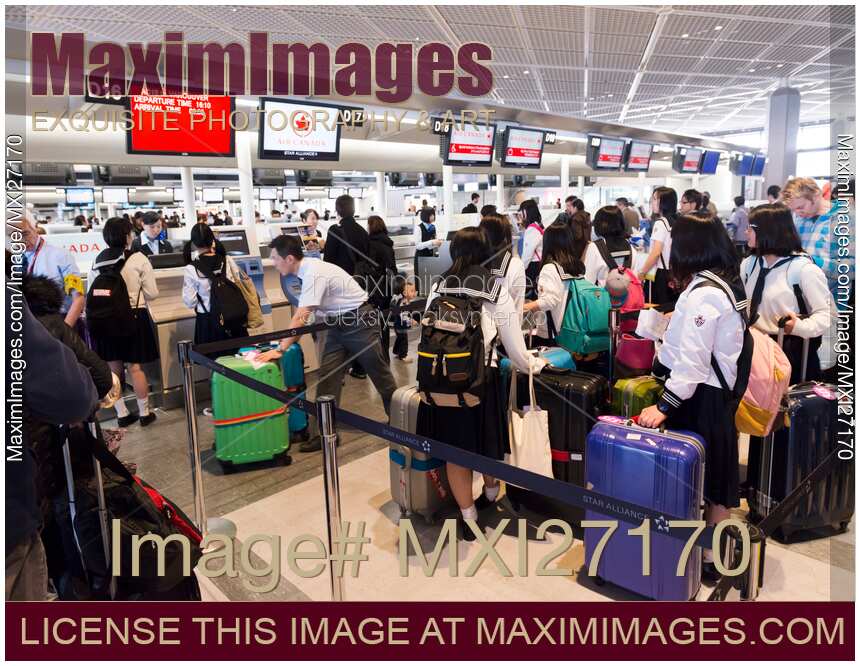 People at check-in counter at Narita airport in Japan