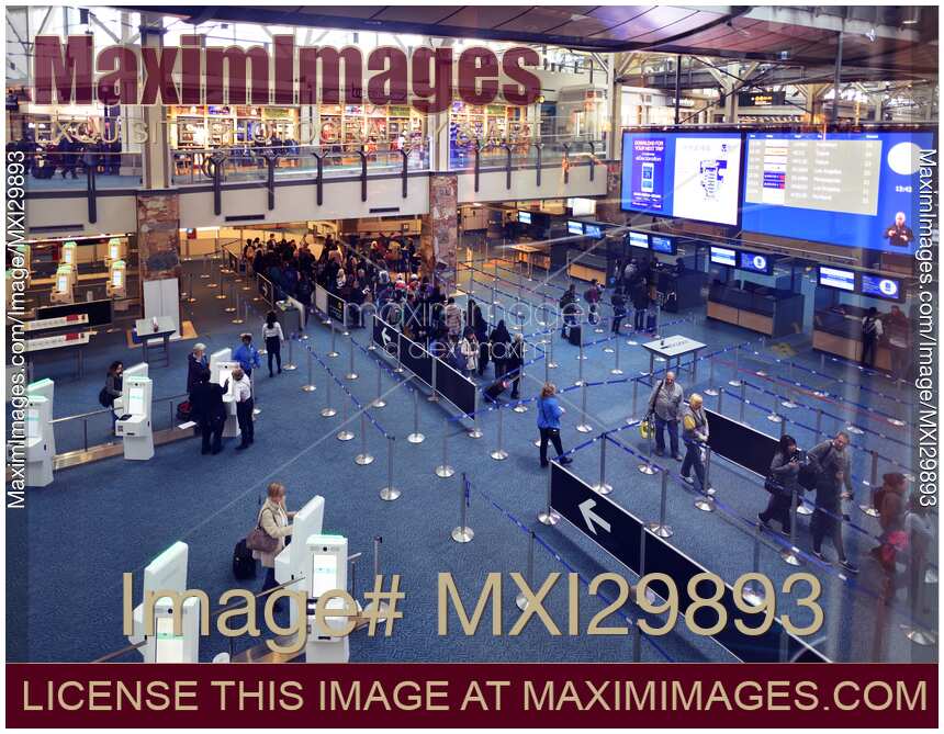 People at Vancouver International Airport arrivals security counters interior