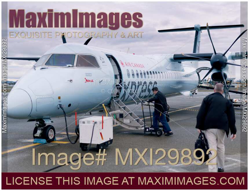 People boarding Air Canada Jazz Express plane at Victoria International Airport