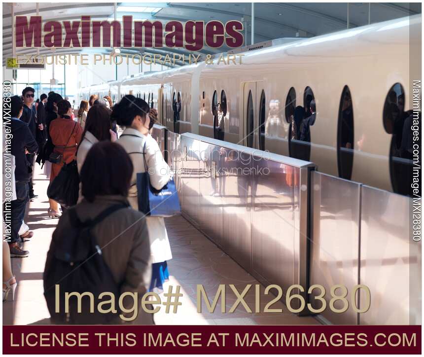 People boarding Disney Resort Line train in Tokyo