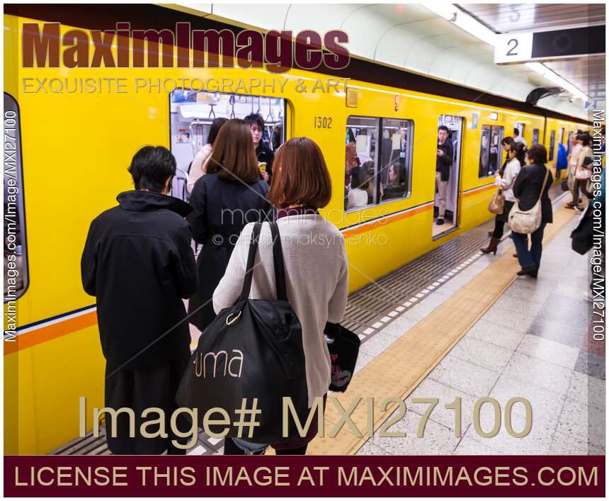 People entring subway train in Tokyo