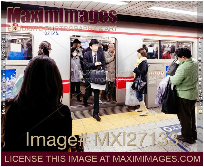 People exiting a subway train in Tokyo