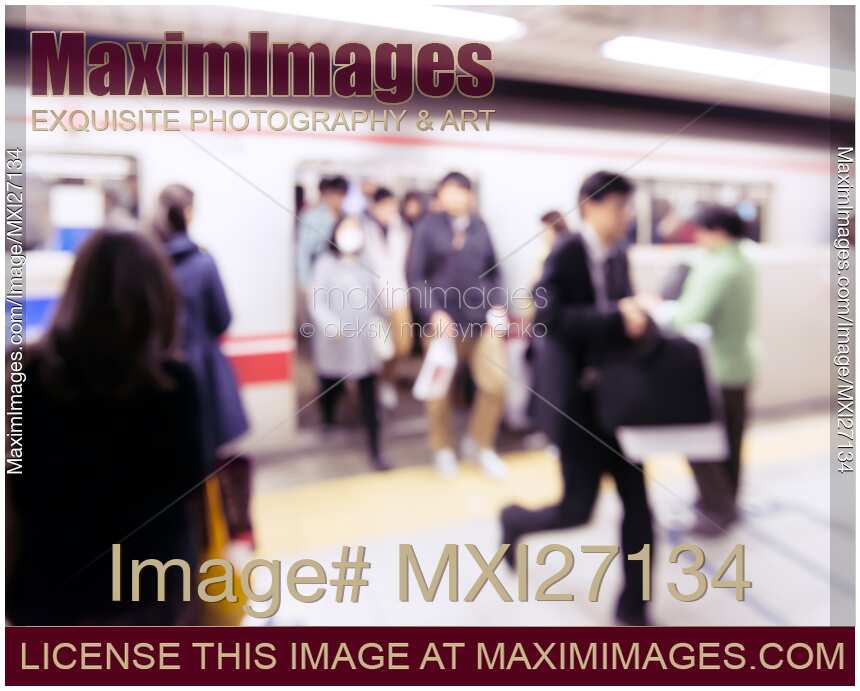 People getting off subway train in Tokyo Abstract concept