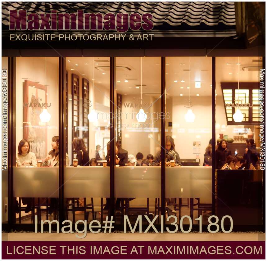 People in a cafe behind the window