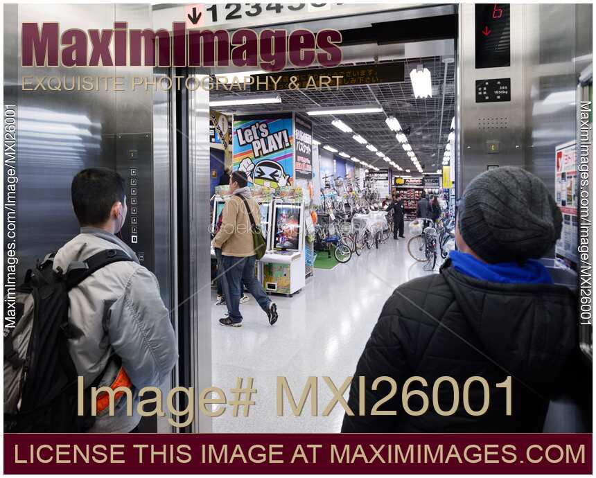 People inside elevator in store