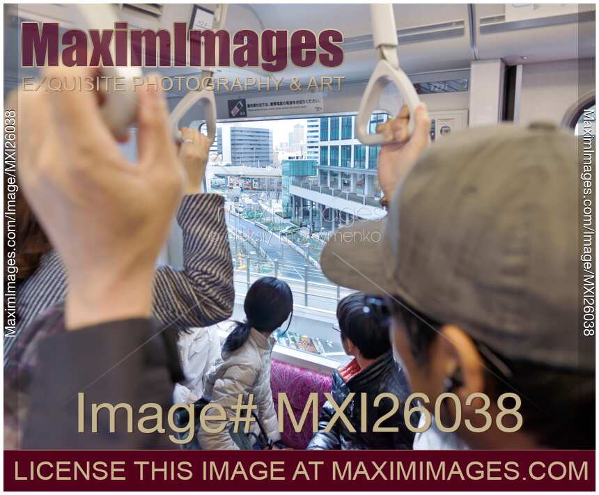 People on a train Tokyo Japan