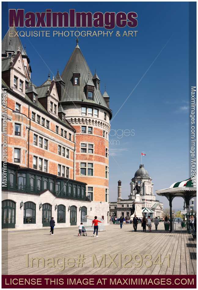 People on Dufferin terrace boardwalk by the Fairmont Le Chateau Frontenac castle in old Quebec city